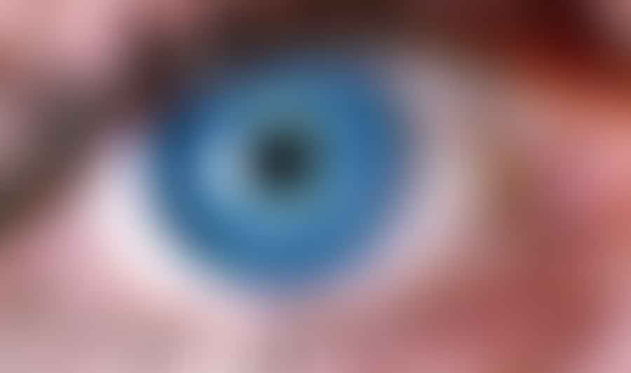 Close-up view of a human eye representing the concept of refresh rate